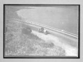 [auto driving near water]