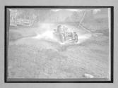 [auto racing through waterhole]