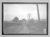 [auto driving on country road]