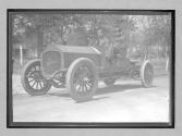 [two men in auto "The Acme"]