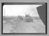 [#5 Marmon" driven by H. C. Marmon stopping at disabled auto]