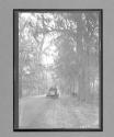 [auto on country road]