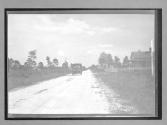 [auto driving on country road]