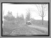 [auto on country road]