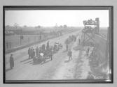 [autos lined up at track "#2, #3"]