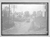 [auto driving on village street]