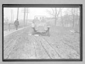 [auto driving on rutted country road "Premier"]