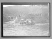 [auto stuck in river]