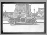 [auto in front war monument in Indiana]