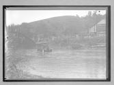 [auto crossing through river]