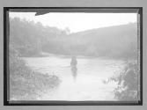 [man on horse crossing river]