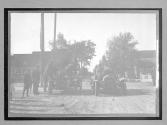 [autos lined up in town "#53, #63"]