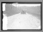 [auto driving on country road]