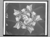[Woman's Face In Roses]