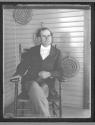 [William Jennings Bryant seated on porch]