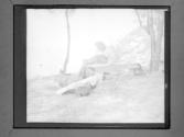 [Gertrude G., Laura M., And Clarence L. Fisher Resting By Outdoor Bench]