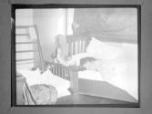 [Gertrude G. Fisher Sleeping In Bed]