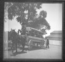 [People Aboard Covered Horsecart]