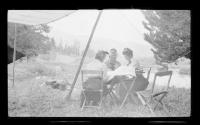 Josephine Dickman and Eastwoods at campsite table, Wyoming Trip