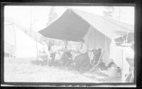 Josephine Dickman and Eastwoods at table in tent, Wyoming Trip
