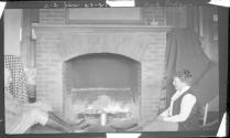 Eastwoods by fireplace, Oak Lodge Trip