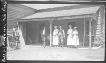 George Eastman and guests on porch of house, Oak Lodge Trip