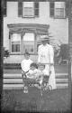 Women in Eastman's garden with Dryden children and Watson Newhall