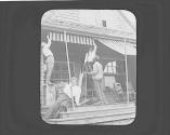 George Eastman and friends putting up awning, Oak Lodge Trip