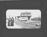 Josephine Dickman and friend on driveway in front of house, Petersham Trip