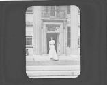Woman in front of door of GEH