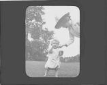 Woman with child on lawn