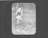 George Eastman and George Eastman Dryden looking into pond