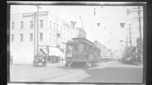 [Electric trolley on city street]