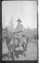 Dr. Stewart on horse, Alaska trip
