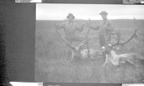 Hunting companions with dead caribou, Alaska trip
