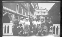 [Group portrait on bridge over canal]