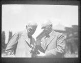 George Eastman and Thomas Edison looking at camera, Kodacolor Party