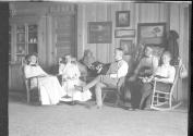 George Eastman and guests inside Lodge, Oak Lodge Trip