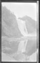 [Three women by river below falls]