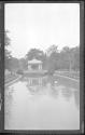 [Man rowing on canal in park]