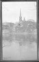 [View of town along river]