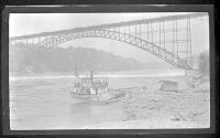["Maid of the Mist" on river below bridge]
