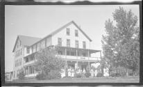 [Group of people outside large building "Geneva"]