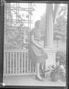 [Portrait of woman on porch]