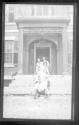 [Group on fron steps of house]