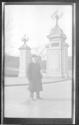 [Man by entrance gate]