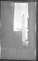 [Street scene, skyscraper in distance]