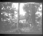 [Wooded landscape with house]