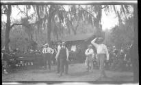 [Men playing horseshoes (?)]