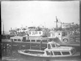 Harbor-people in line to board boat